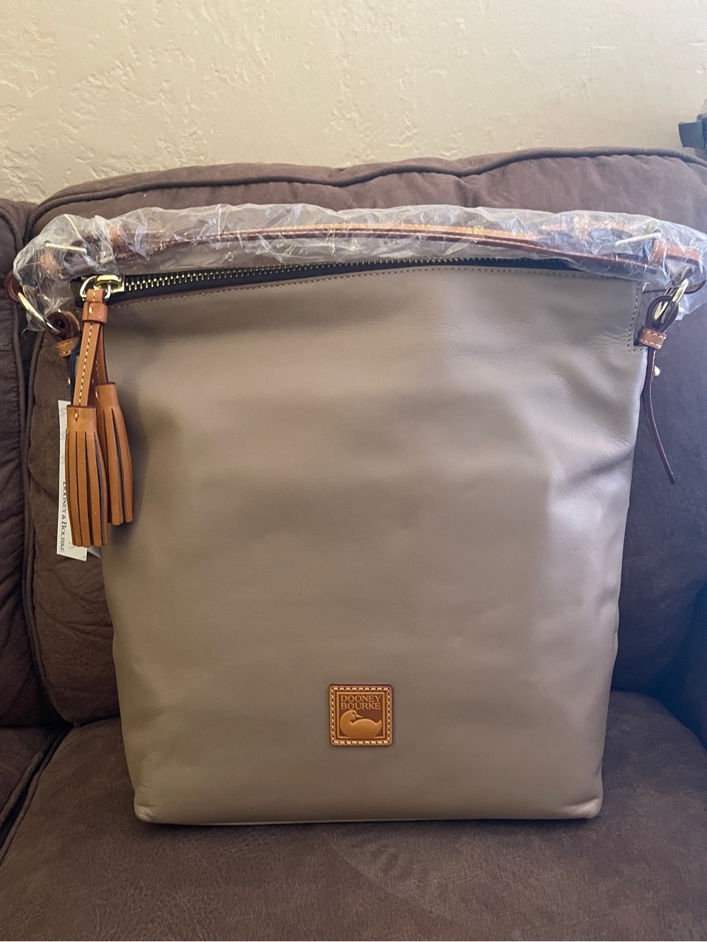 Dooney & Bourke Taupe Leather Bag with Tan Tassel